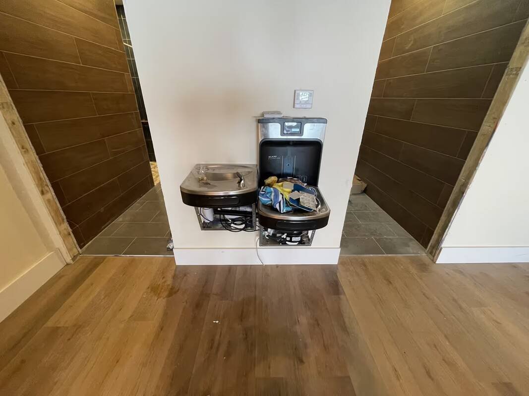 Newly installed drinking fountain with a bottle filler in a commercial building