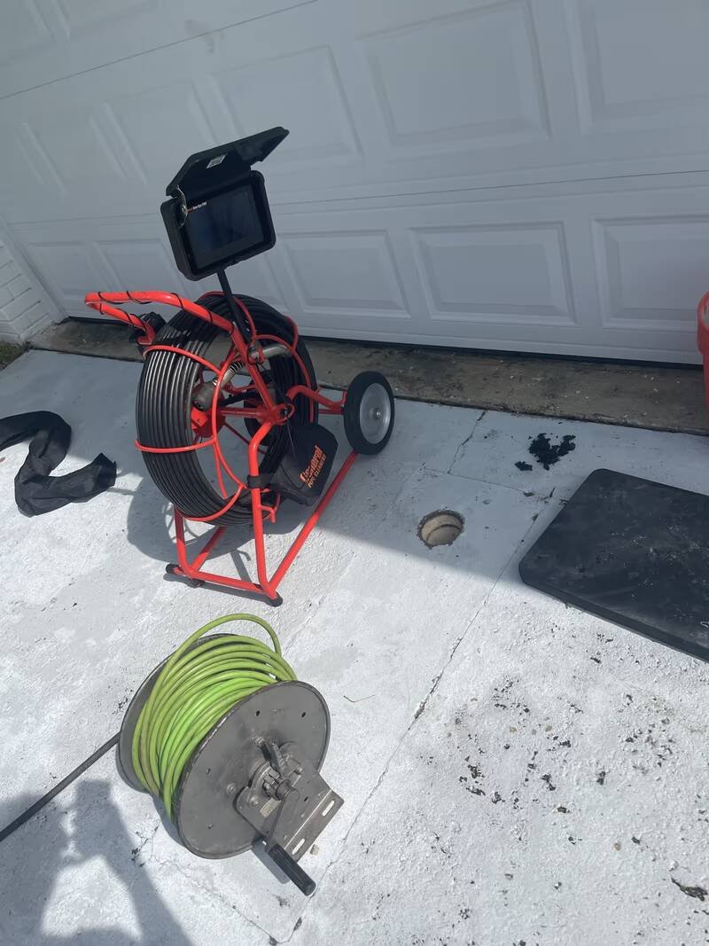 Sewer inspection camera reel and jetter hose reel set up on a job